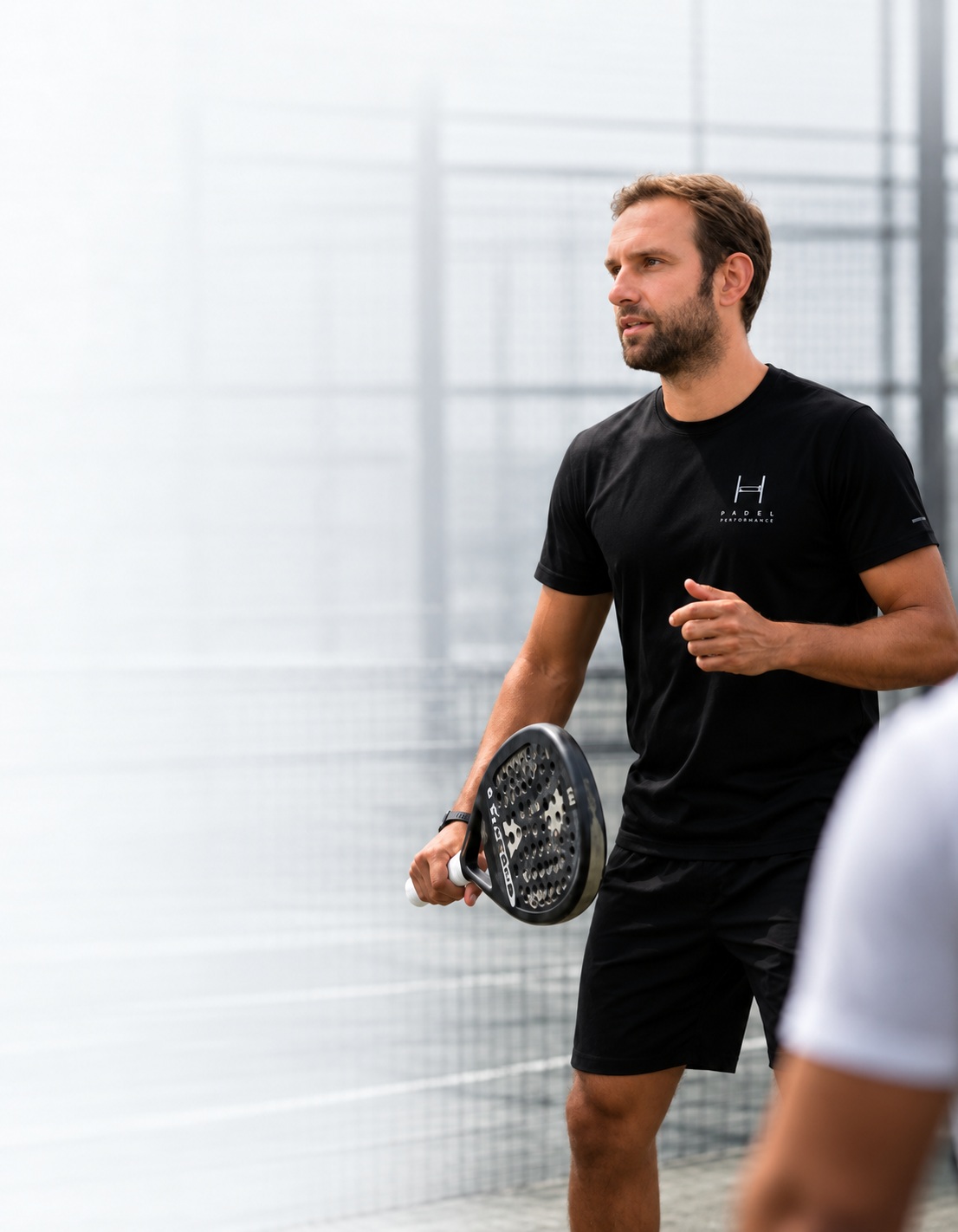 Padel player holding a racket on court